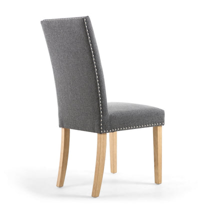 Pair of Grey Linen Effect Dining Chairs Stud Detail - Natural Rubberwood Legs